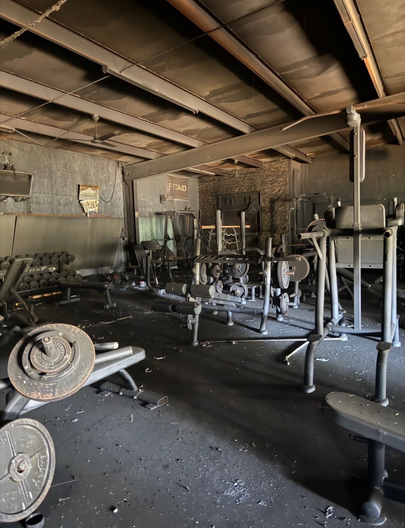 The iron remained. Coated in ash, still standing.